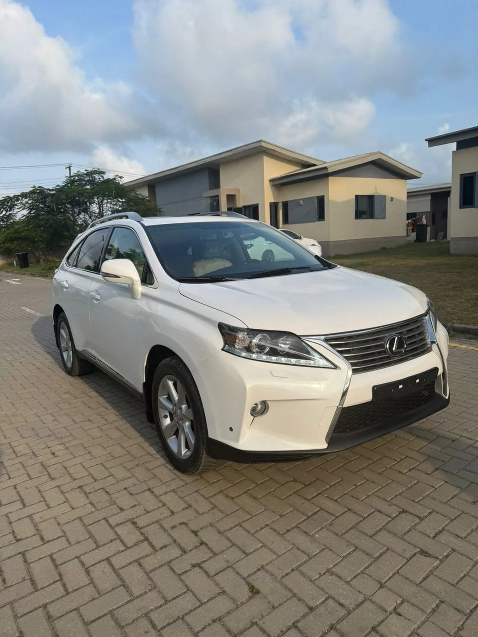 White Lexus RX SUV delivered to client driveway