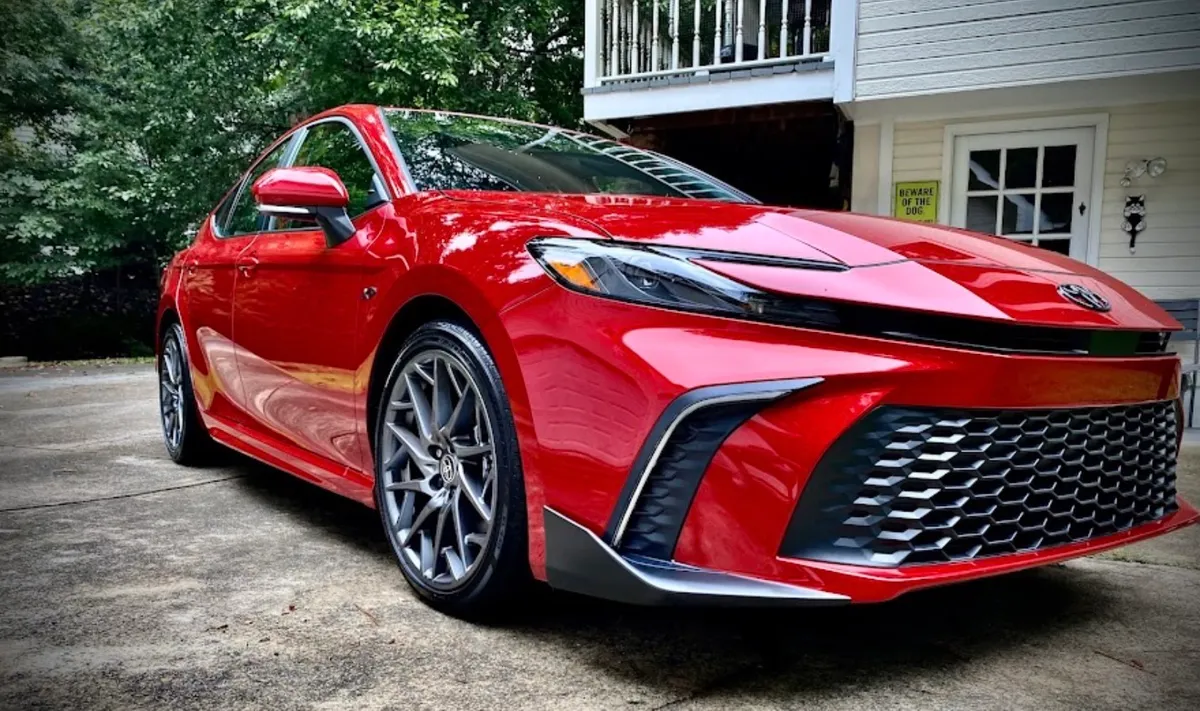 Red Toyota Camry delivered to client driveway